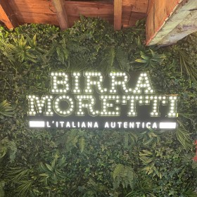 Birra Moretti Logo Bulb Sign with Foliage Wall Panels